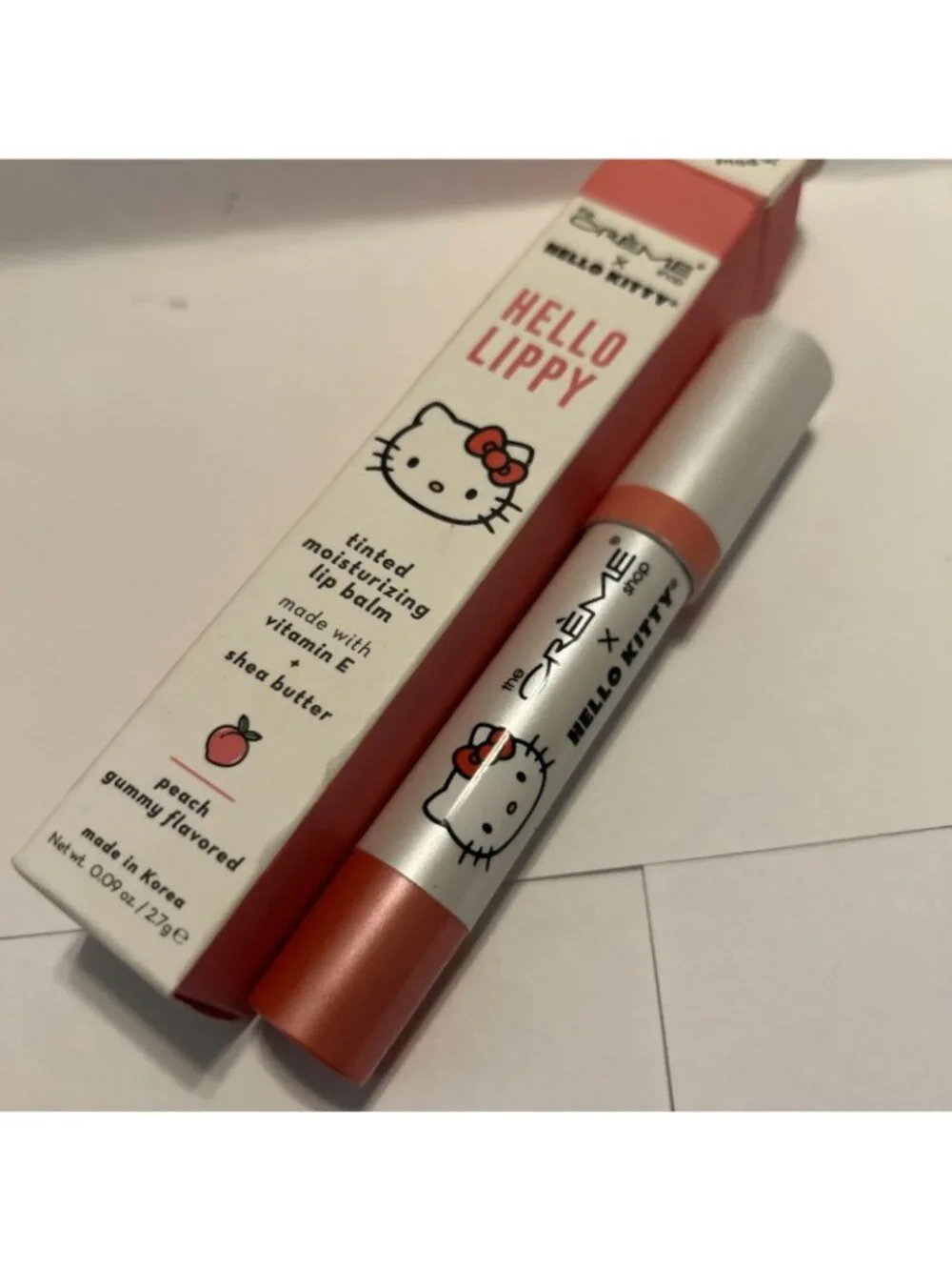 The Crème Shop Hello Kitty & Friends Tinted Peach Moisture Lip Balm Stick .09oz